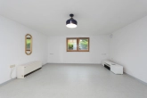 Hobbyraum im Untergeschoss - Familienfreundliches Einfamilienhaus mit Garten, Terrasse und Garage