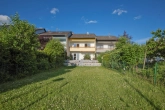 Gartenansicht - Ruhig gelegenes, energetisch saniertes Reihenmittelhaus mit Garten und Garage