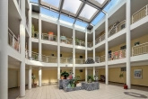 Atrium - Außergewöhnliche 2-Zimmer-Wohnung mit Dachterrasse und TG-Stellplatz