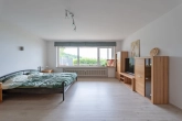 Schlafzimmer im Gartengeschoss - Ihr Rückzugsort in bester Aussichtslage – Modernes Einfamilienhaus mit Einliegerwohnung